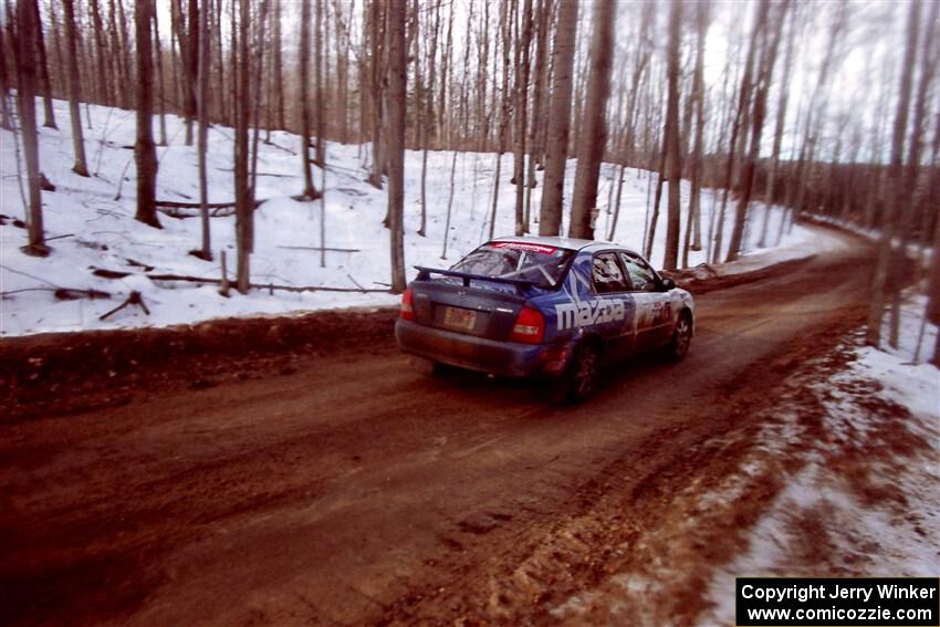 Eric Burmeister / Eric Adams Mazda Protege' MP3 on SS9, Camp 8.