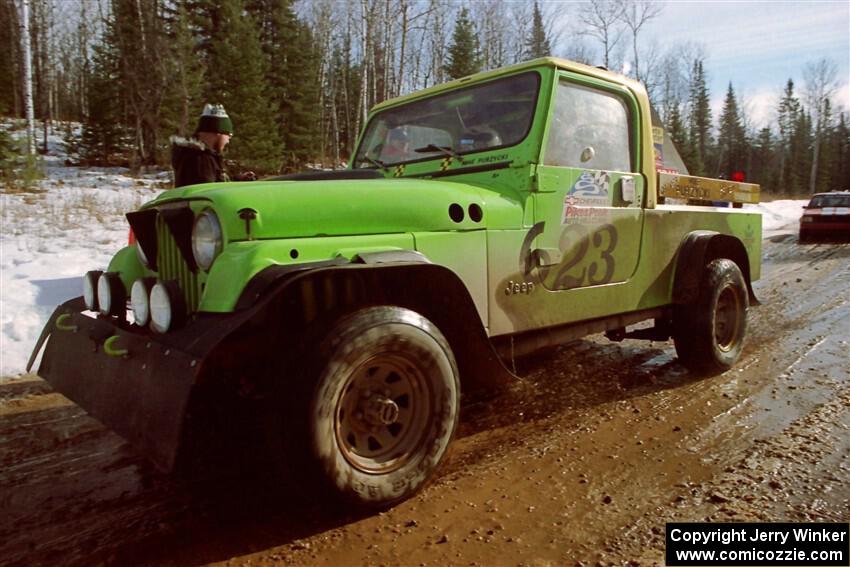 Mike Purzycki / Karen Purzycki Jeep Scrambler leaves the start of SS10, Camp 30.