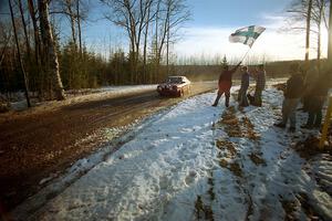 Jake Himes waves the Finnish flag for the Jon Kemp / Rod Hendicksen Audi 4000 Quattro on SS14, Meaford.