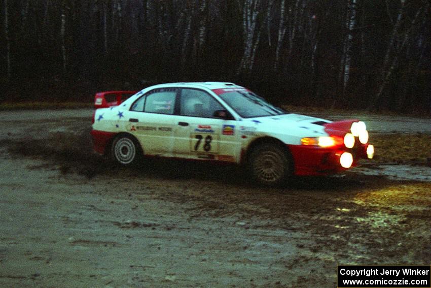 Paul Dunn / Pete Gossett Mitsubishi Lancer Evo IV at the spectator corner on SS4, Blue Trail.