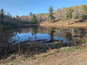 The view of a small lake at the NE corner of the crossroads.