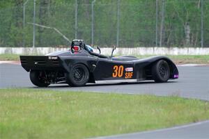 Will Cammack's Spec Racer Ford spins in the carousel.