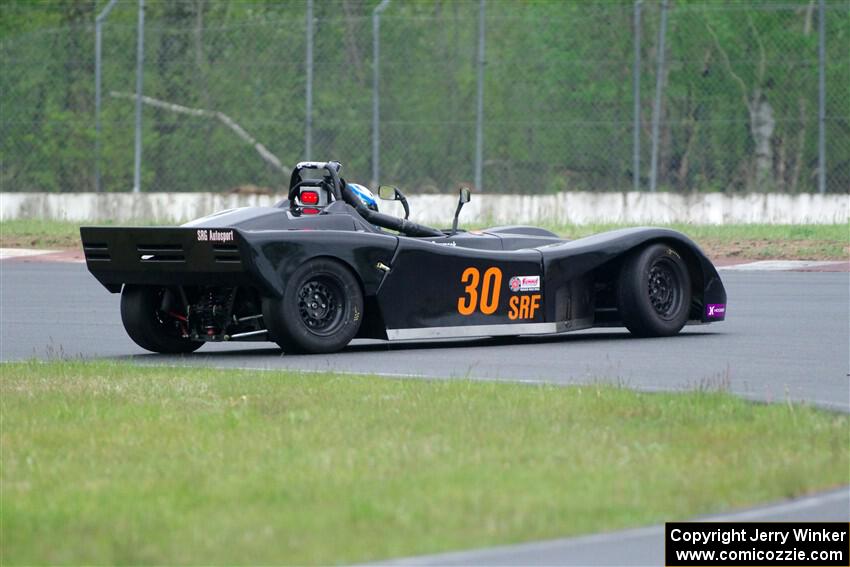 Will Cammack's Spec Racer Ford spins in the carousel.