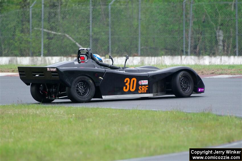 Will Cammack's Spec Racer Ford spins in the carousel.