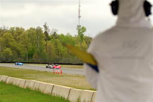 Ben Anderson's, Justin Elder's, Nolan Elder's and Lauren Dueck's Spec Racer Ford 3s come out of turn 3 on lap 1.