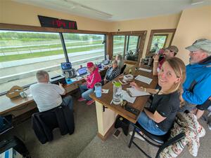 The Timing and Scoring crew prepare for the next race group.