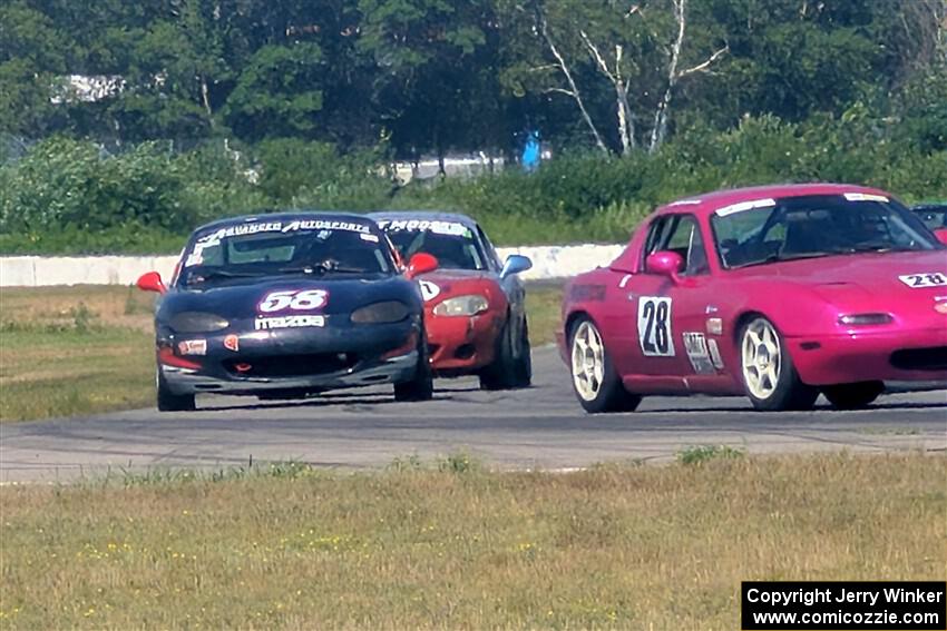 Josh Jablonski's, Austin Pearce's and Chris Craft's Spec Mazda Mazda Miatas