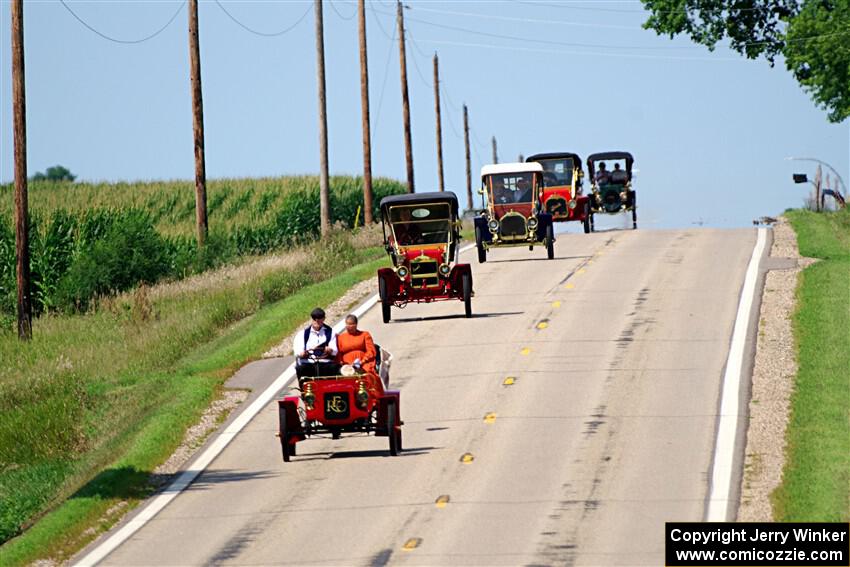 Five cars stream down a hill on the way into Buffalo.