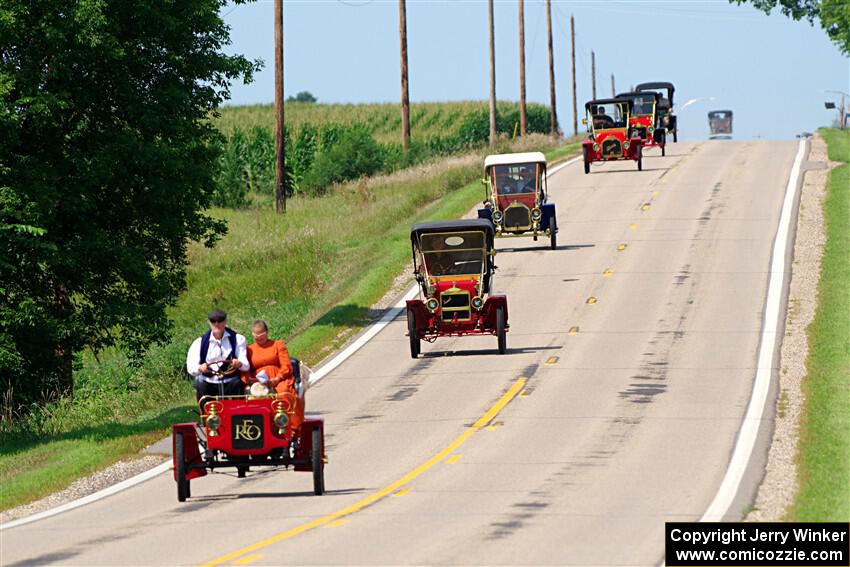 Five cars stream down a hill on the way into Buffalo.