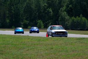 Brooke Fairbanks' H Production VW Golf with Rick Buan's and Luke Allen's Spec Miata Mazda Miatas