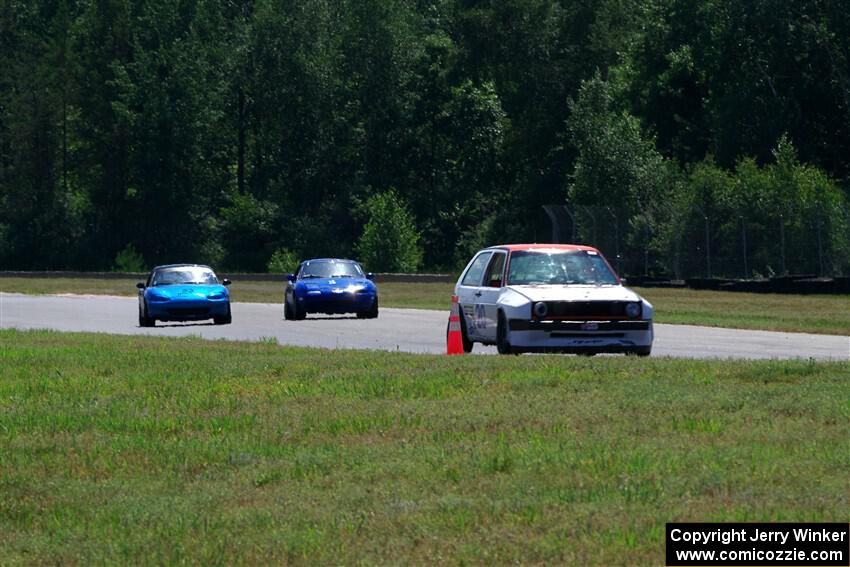 Brooke Fairbanks' H Production VW Golf with Rick Buan's and Luke Allen's Spec Miata Mazda Miatas