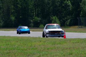 Brooke Fairbanks' H Production VW Golf with Rick Buan's and Luke Allen's Spec Miata Mazda Miatas
