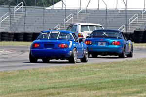 Brooke Fairbanks' H Production VW Golf with Rick Buan's and Luke Allen's Spec Miata Mazda Miatas