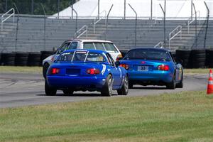 Brooke Fairbanks' H Production VW Golf with Rick Buan's and Luke Allen's Spec Miata Mazda Miatas