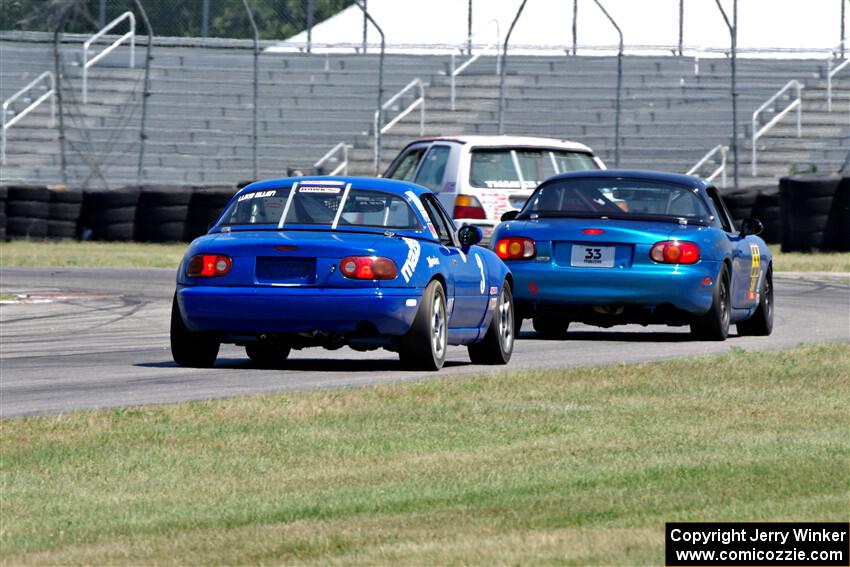 Brooke Fairbanks' H Production VW Golf with Rick Buan's and Luke Allen's Spec Miata Mazda Miatas