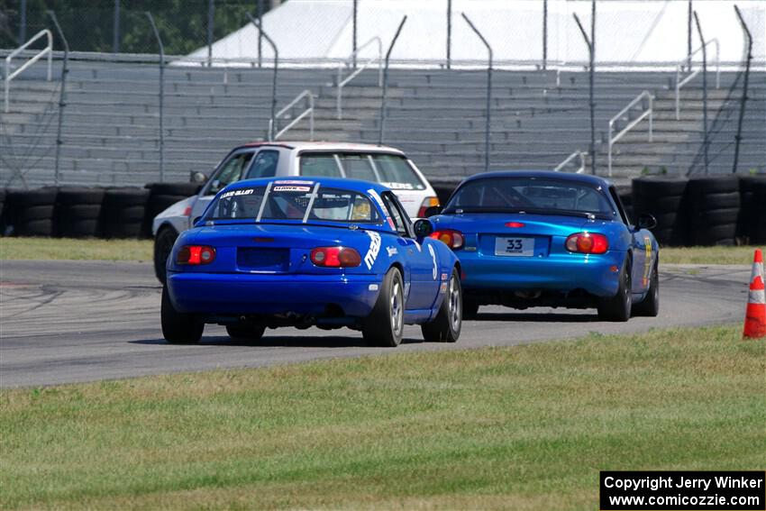 Brooke Fairbanks' H Production VW Golf with Rick Buan's and Luke Allen's Spec Miata Mazda Miatas