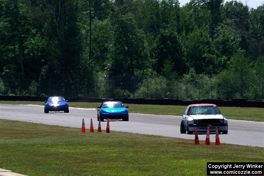 Brooke Fairbanks' H Production VW Golf with Rick Buan's and Luke Allen's Spec Miata Mazda Miatas