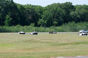 Race Group 4, Formula Cars and Sports Racers, streams through turns 4 and 5 on the pace lap.