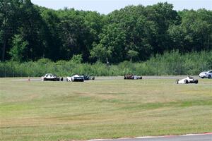 Race Group 4, Formula Cars and Sports Racers, streams through turns 4 and 5 on the pace lap.