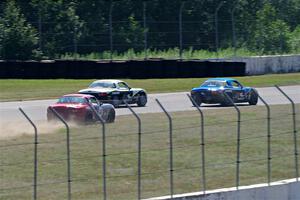 Kyle Greenhill's and Samantha Silver's Spec Miata Mazda Miatas pass Chris Craft's Spec Miata Mazda Miata