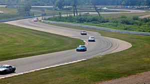 Spec Miatas stream through turns 9 and 10 during Sunday's race.
