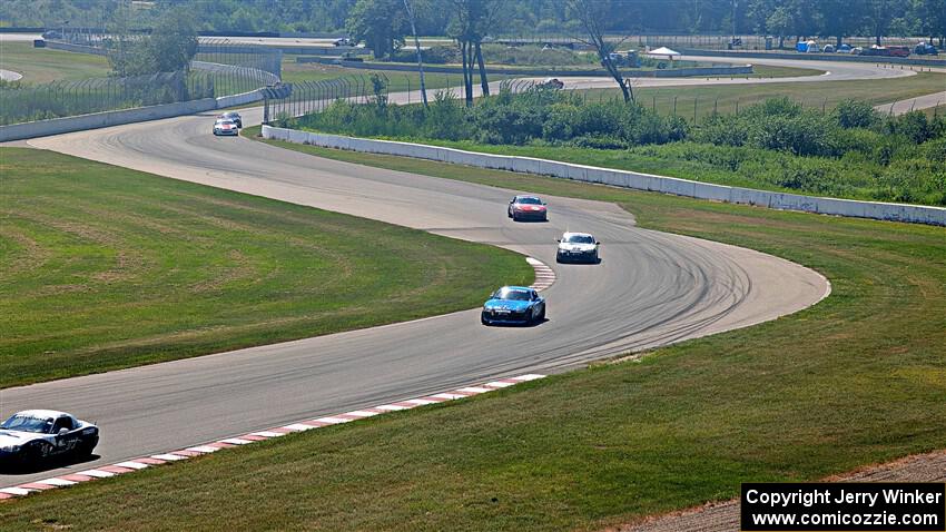 Spec Miatas stream through turns 9 and 10 during Sunday's race.