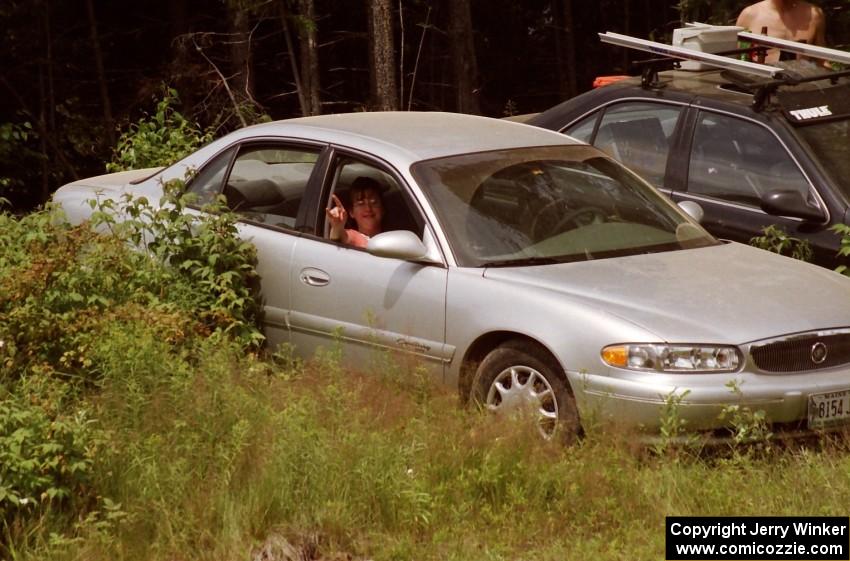 Nicole Valek (now Winker) hangs out in the car to avoid the thick black flies.