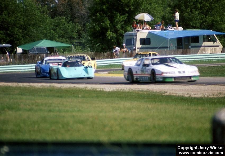 Five cars go through turn 8