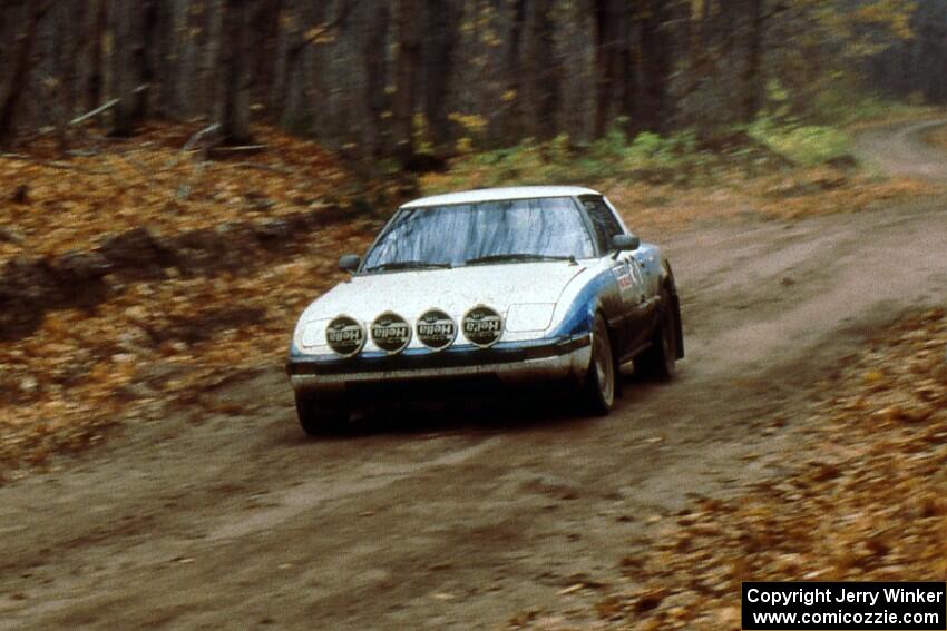 The Waheed Khan / Deb Boudreau Mazda RX-7 at speed on the first stage of day two.