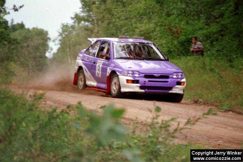 Carl Merrill / John Bellefleur flog their Ford Escort Cosworth over a rise on Indian Creek Trail Rd.