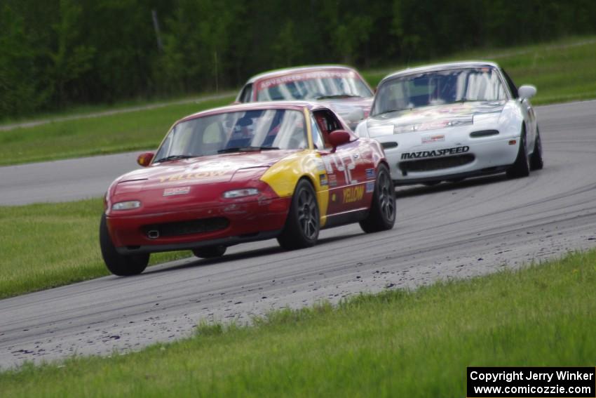 Greg Youngdahl's ITA/Spec Miata Mazda Miata, Justin Elder's Spec Miata Mazda Miata and Lon Blaser's Spec Miata Mazda Miata