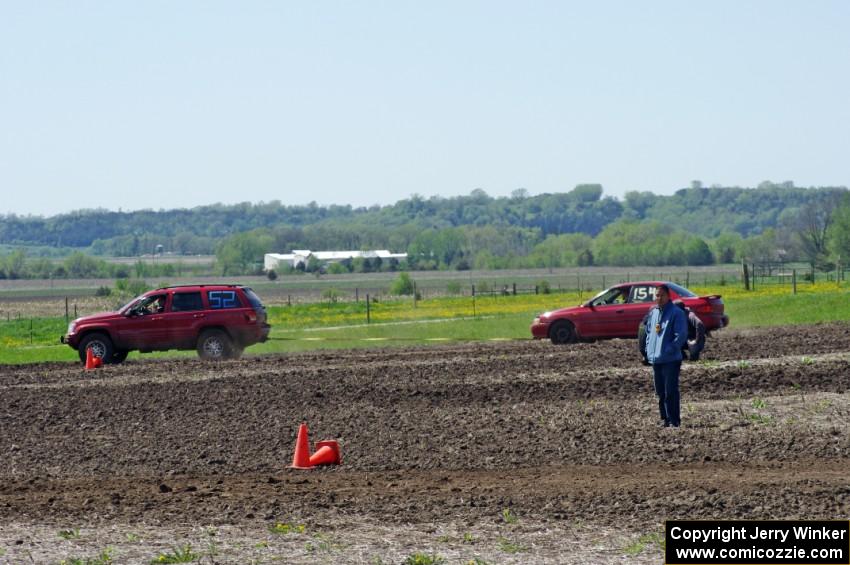 Peter Battle's SA Subaru Impreza is pulled off-course by Dan Drury's PA Jeep Grand Cherokee