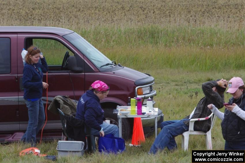 Carrie Carlson, Mary Utecht, ??? and Kathy Freund take a break at the timing area