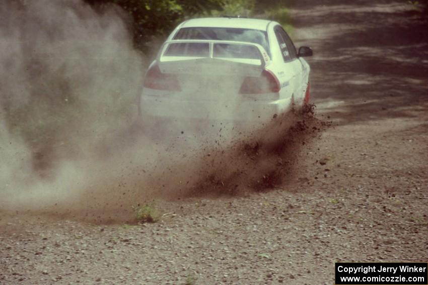 Chris Gilligan / Joe Petersen Mitsubishi Lancer Evo IV at the SS9 (Heart Lake) spectator area.