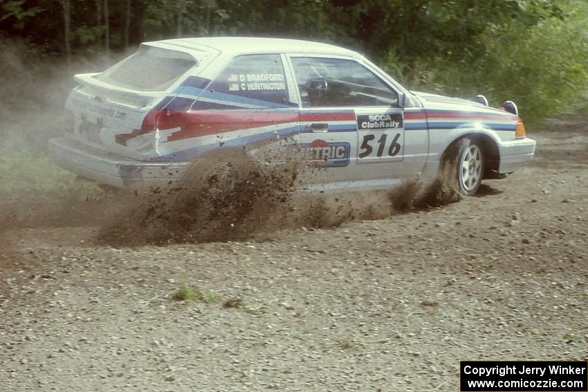 Chris Huntington / Doug Bradford Mazda 323GTX at the SS9 (Heart Lake) spectator area.