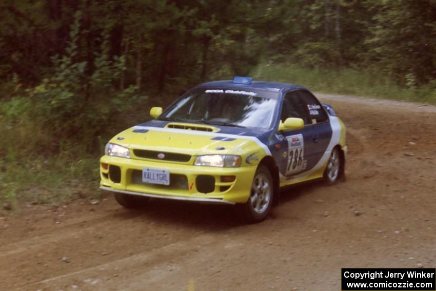 Joan Hoskinson / Rob Bohn Subaru Impreza 2.5RS at a 90-right on SS13, Indian Creek.