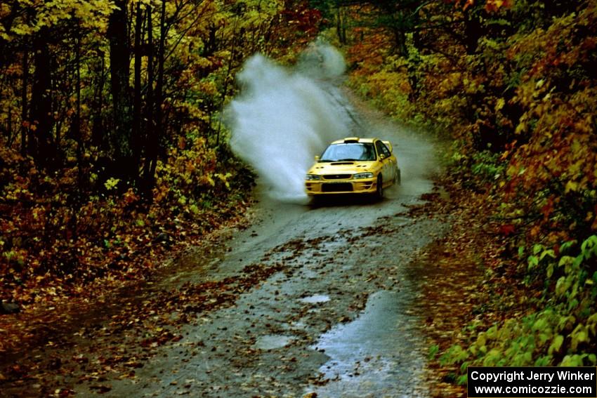 Tim O'Neil 	/ Martin Headland Subaru Impreza hits a big puddle on SS8, Gratiot Lake.