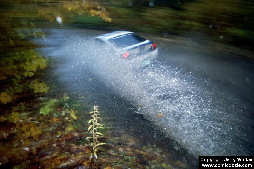 Seamus Burke / Brian Sharkey Hyundai Tiburon hits a big puddle on SS8, Gratiot Lake.