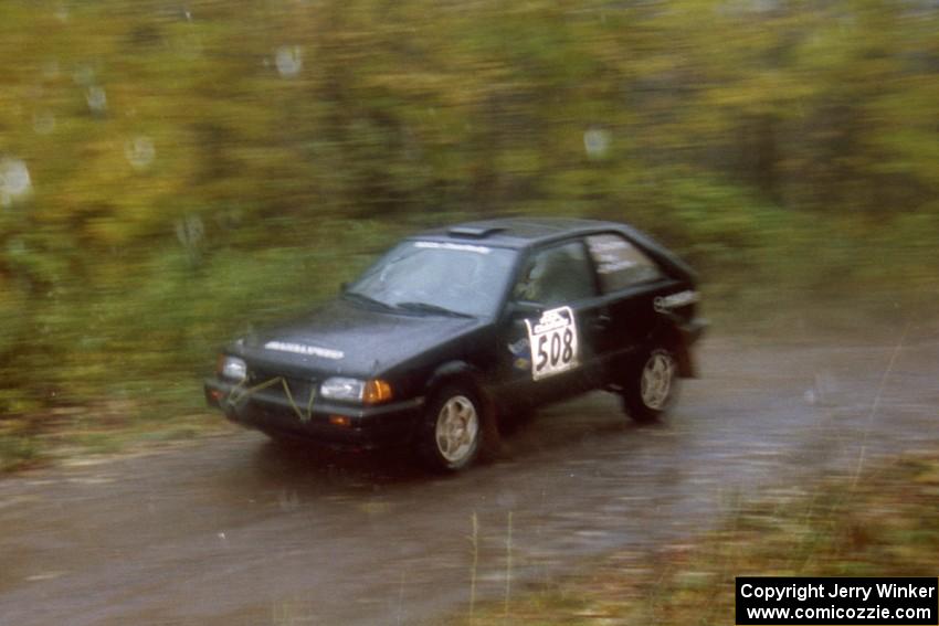 Tom Ottey / Pam McGarvey Mazda 323GTX on SS8, Gratiot Lake.