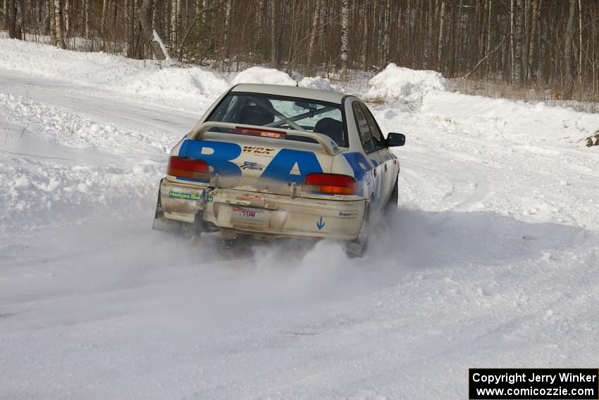 Henry Krolikowski / Cindy Krolikowski blast through a left-hander on the first stage of day two in their Subaru WRX.