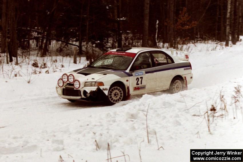 The Chris Gilligan / Joe Petersen Mitsubishi Evo IV sets up for a hard-right near the end of day two of the rally.