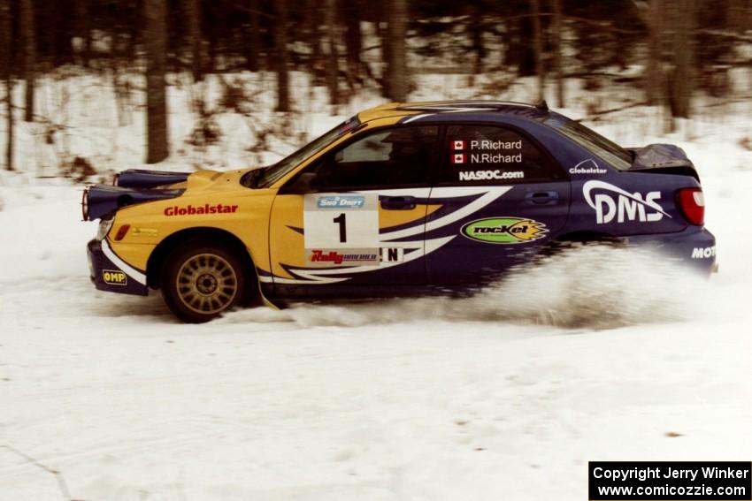 The Pat Richard / Nathalie Richard Subaru WRX STi powers through a hard right-hander on a stage near the end of the rally.