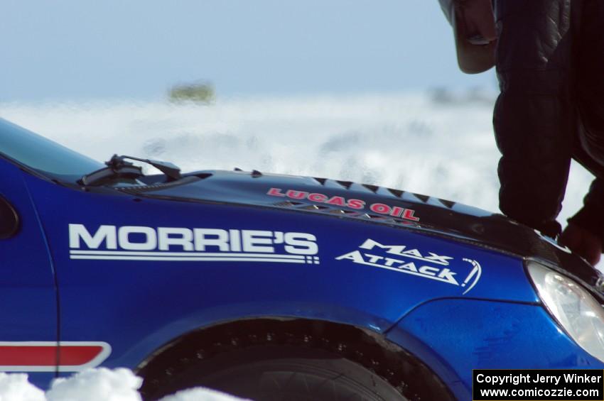 Heat rises from the engine of the Cary Kendall / Scott Friberg Dodge SRT-4