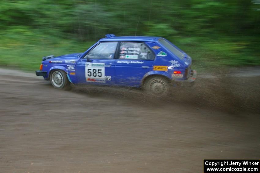 Dave Sterling / Stacy Sterling Dodge Omni GLH at speed through a 90-right on SS2, Spur 2.