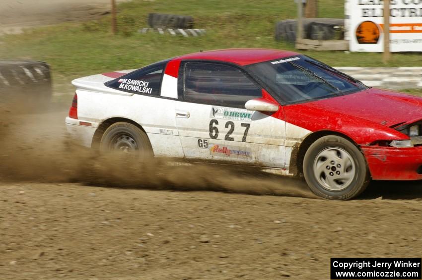 Marcin Kowalski / Maciej Sawicki Mitsubishi Eclipse GST drifts through the infield at the Bemidji Speedway, SS8.