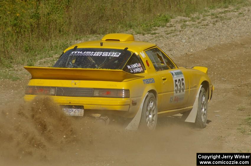 Jake Himes / Matt Himes Mazda RX-7 sprays gravel through an uphill right on SS10, Chad's Yump.