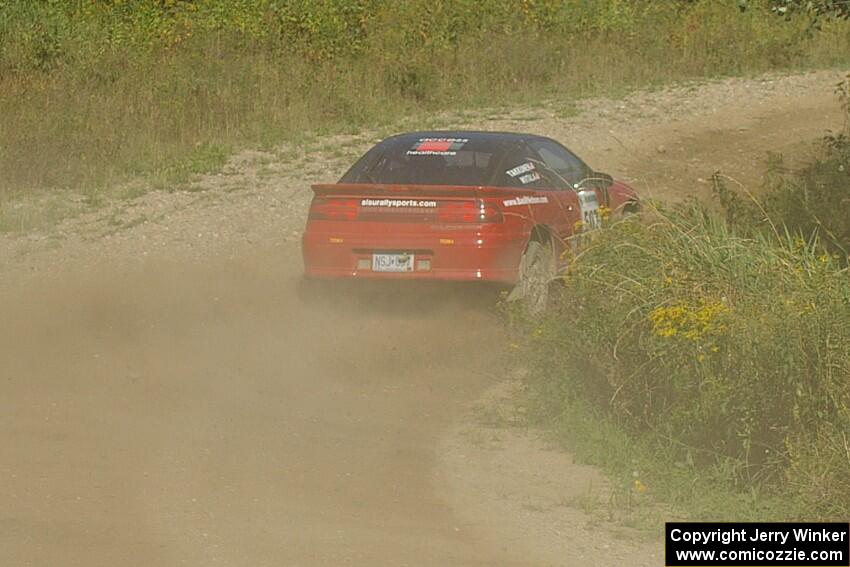 Micah Wiitala / Jason Takkunen Mitsubishi Eclipse GSX goes through an uphill left sweeper on SS10, Chad's Yump.