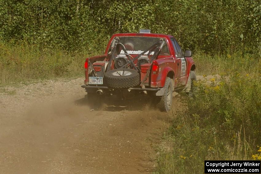 Jim Cox / Richard Donovan Chevy S-10 through an uphill sweeper on SS10, Chad's Yump.