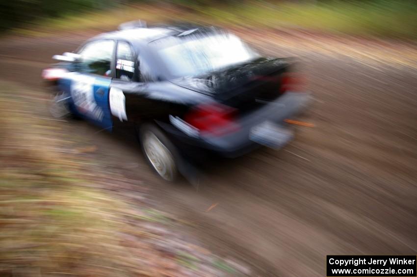 Bryan Holder / Tracy Payeur Plymouth Neon heads uphill near the start of SS1, Herman.