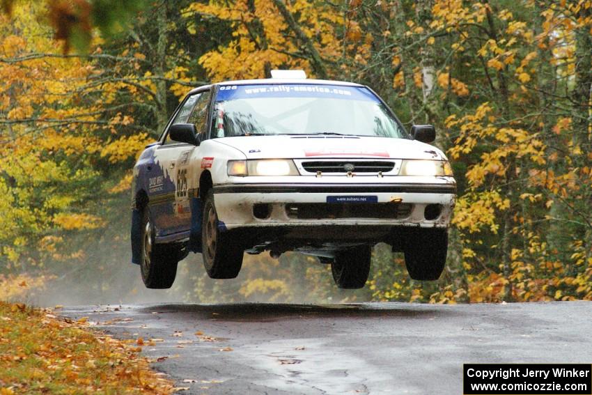 Mike Wray / Don DeRose Subaru Legacy Sport catches nice air at the midpoint jump on Brockway, SS10.